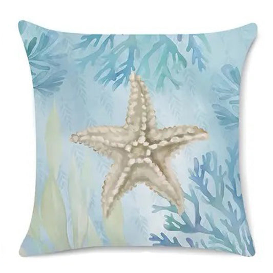 Coastal pillow cover featuring an illustrated starfish on a soft blue background with sea plants.