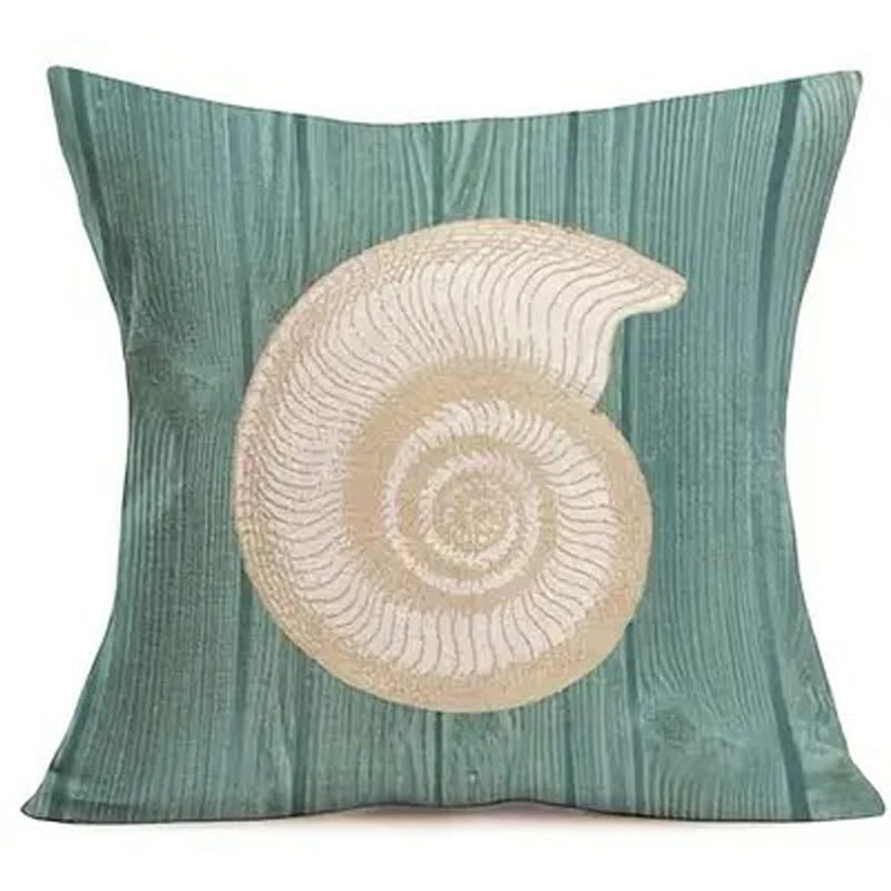 Pillow cover featuring a cream spiral shell on a teal wood grain-style background.