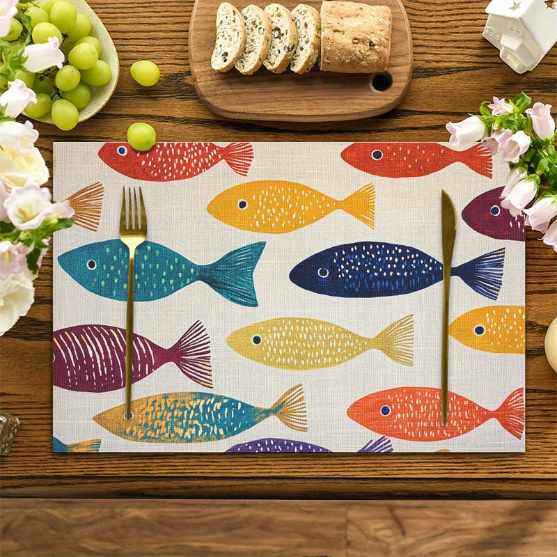 Colorful fish coastal placemats set of four with multicolor fish pattern on dining table.