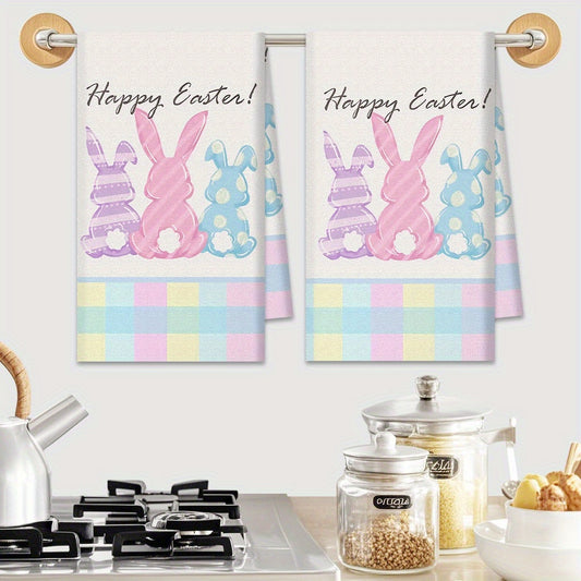 Cheerful 18x26 inch Easter kitchen towels with pastel bunny silhouettes on a colorful plaid background, styled on a counter for seasonal kitchen décor – Coastal Pillows Plus.
