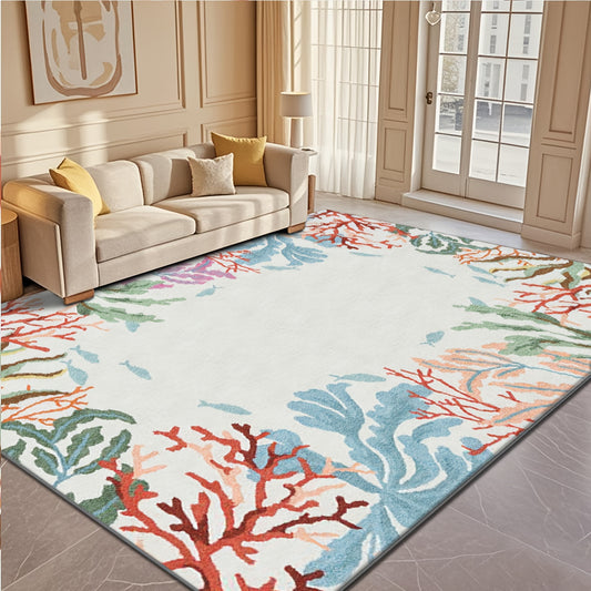 Coastal area rug featuring a colorful coral reef pattern in red, blue, green, and neutral ocean tones.