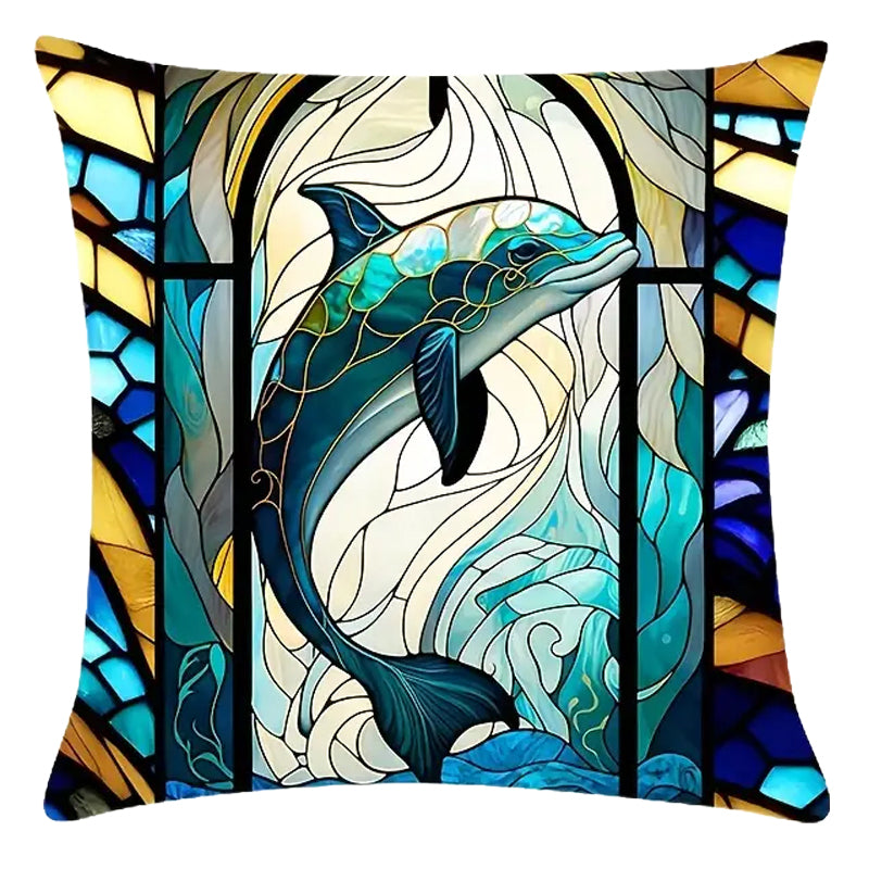 Square pillow cover featuring a dolphin centered within flowing ocean lines and stained-glass-style framing in blue and gold tones.