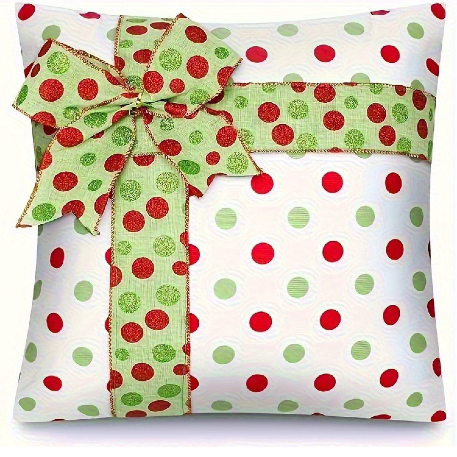 White pillow cover with red and green dots and a ribbon bow
