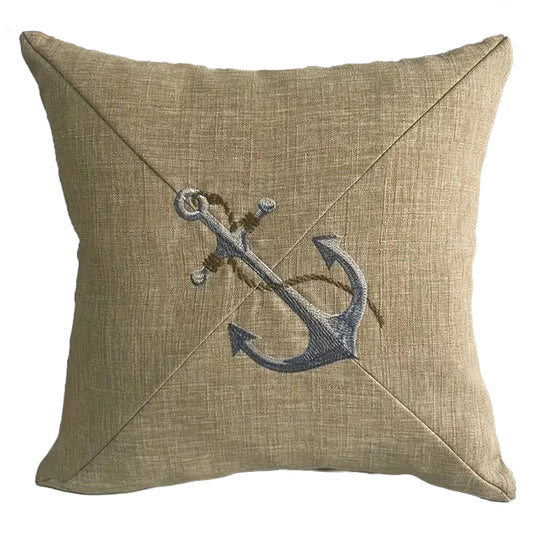 Neutral pillow cover with embroidered anchor design centered on textured fabric for coastal and nautical home decor.