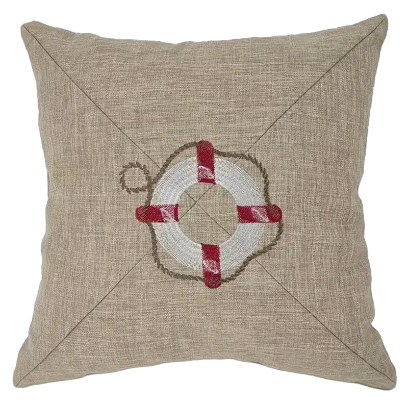 Neutral pillow cover with embroidered life buoy design centered on textured fabric for coastal and nautical home decor.