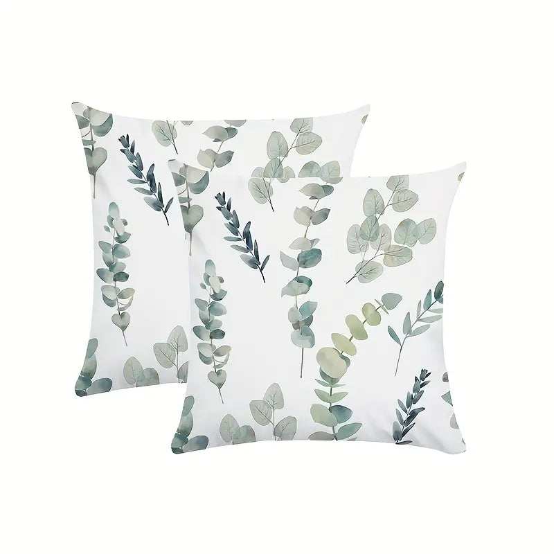 Decorative 18x18 pillow cover featuring a repeating watercolor eucalyptus leaf pattern in soft green tones on a light background.