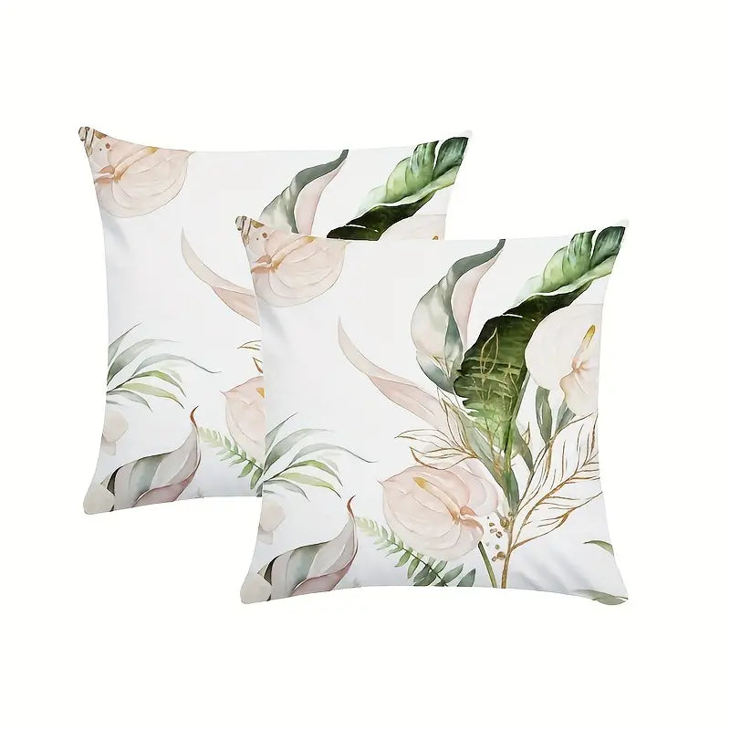 Decorative 18x18 pillow cover featuring eucalyptus branches and soft calla lily blooms on a light background in muted green and neutral tones.