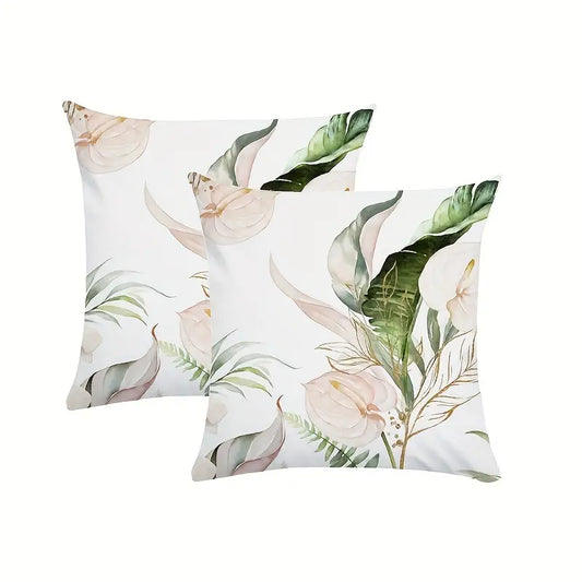 Decorative 18x18 pillow cover featuring eucalyptus branches and soft calla lily blooms on a light background in muted green and neutral tones.
