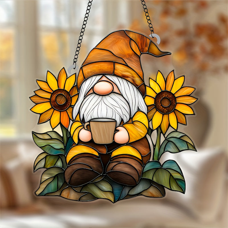 Acrylic stained glass style suncatcher with a fall gnome holding a mug surrounded by sunflowers hanging in a window.