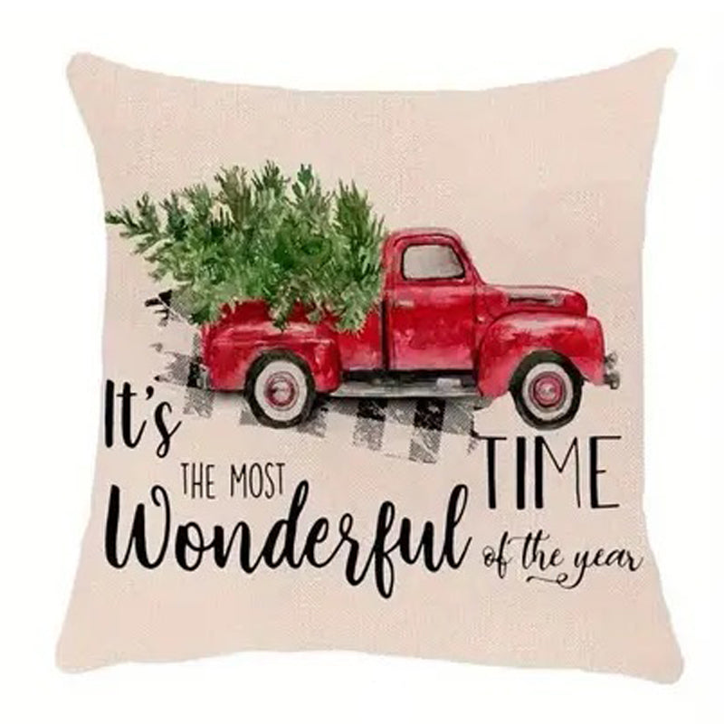 Farmhouse Christmas pillow cover featuring a red truck with a Christmas tree and holiday text on a light background.