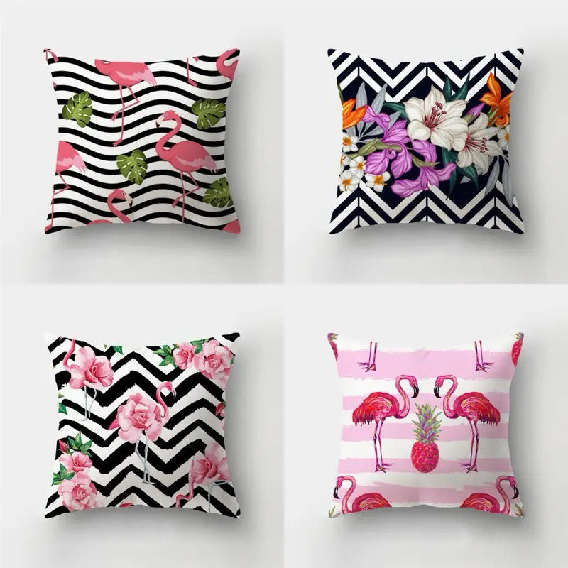 Set of four 18x18 decorative pillow covers featuring flamingos and floral designs with black and white chevron or stripe backgrounds and pink accent elements.