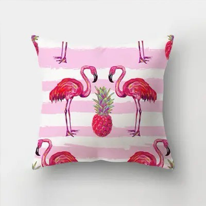 Decorative pillow cover featuring two pink flamingos and a pineapple centered on a soft pink horizontal stripe background.