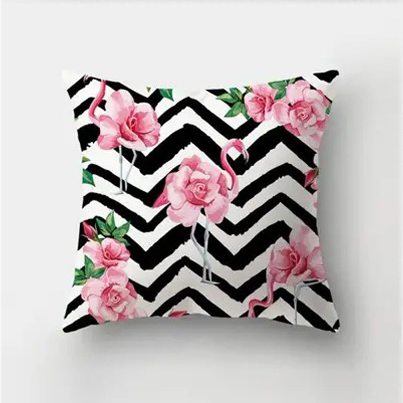 Decorative pillow cover featuring pink roses layered over subtle flamingo silhouettes on a black and white chevron background.