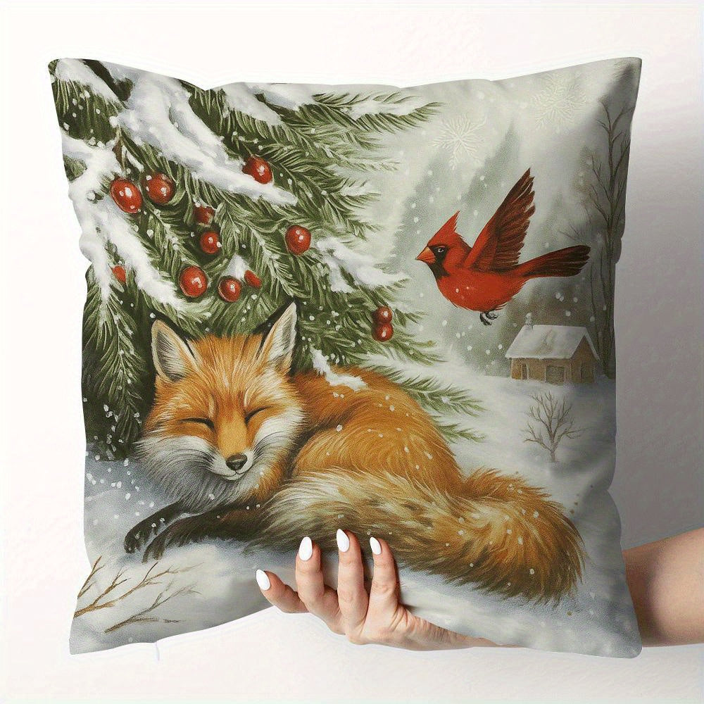 Pillow cover with a fox resting under a snow covered tree with a red bird in a winter scene