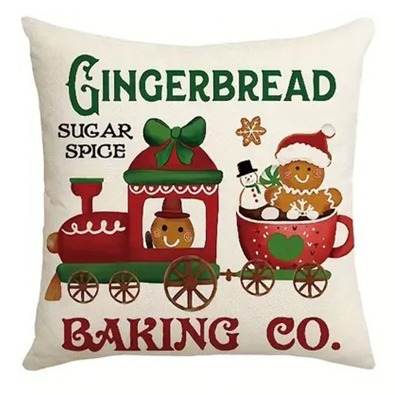 Christmas pillow cover featuring a gingerbread baking company train with gingerbread man and holiday sweets.