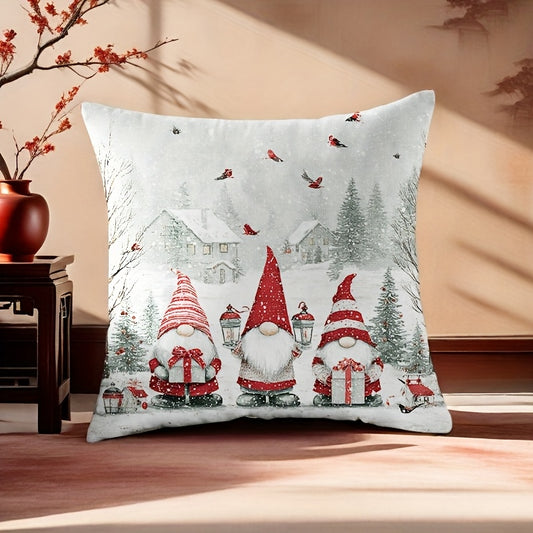 Christmas pillow cover with three gnomes in a snowy village scene with cottages and trees
