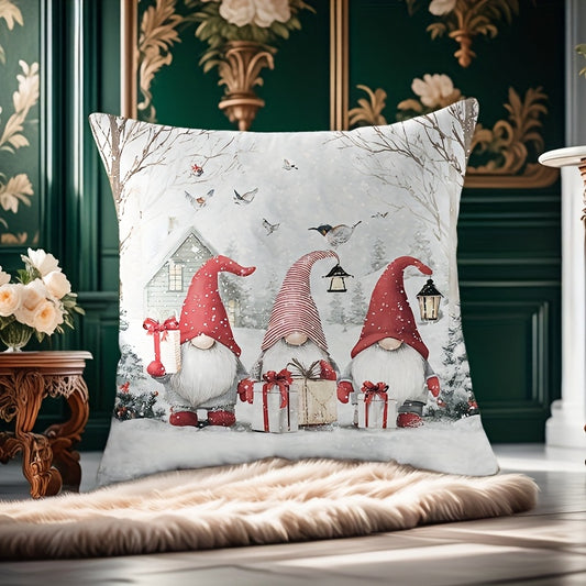 Christmas pillow cover with three gnomes and wrapped presents in a snowy landscape with trees and scattered snowflakes
