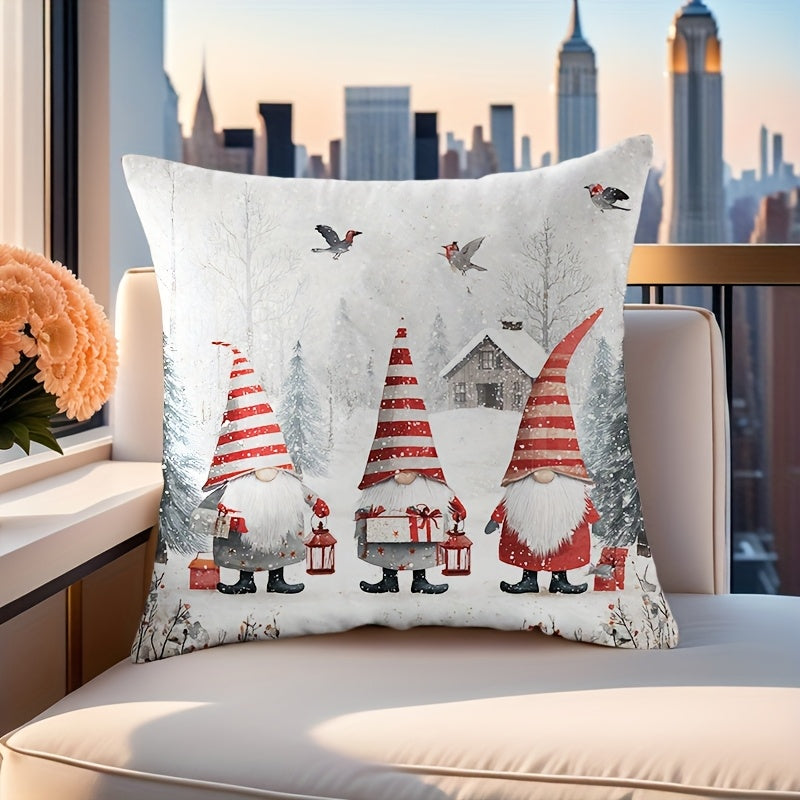 Christmas pillow cover with three gnomes holding lanterns in a snowy setting with trees and falling snow