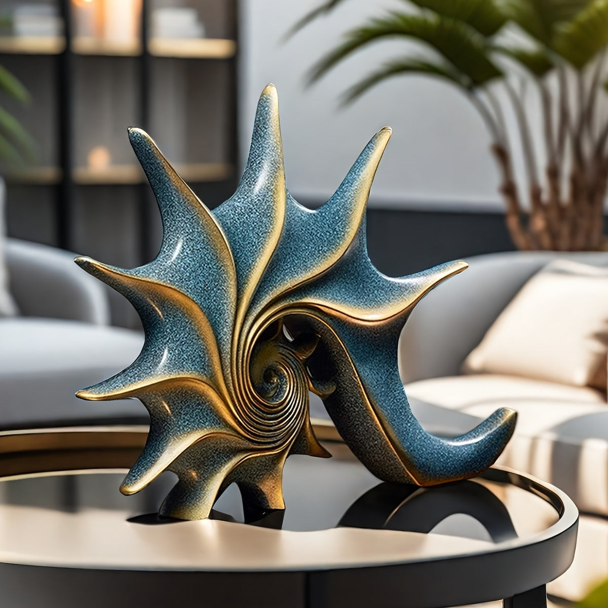 A sophisticated gold and azure blue resin conch shell sculpture for coastal tabletop décor. - Coastal Pillows Plus