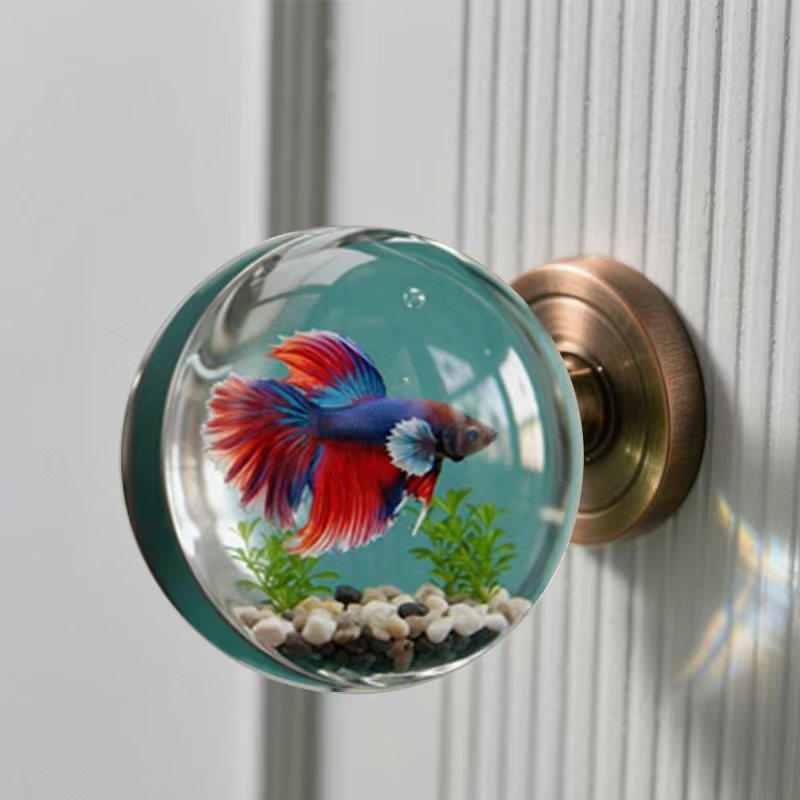 Vintage nautical resin door knob with a 3D guppy design in a clear globe, adding a touch of coastal charm to home décor.