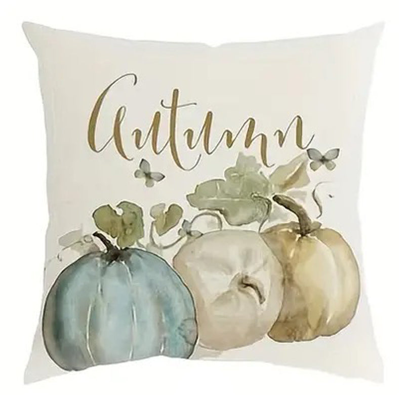 Linen pillow cover with “Autumn” script above three pumpkins in muted green and cream tones.