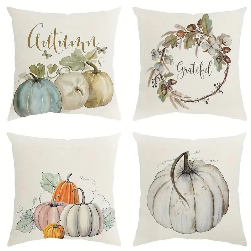 Four linen pillow covers featuring autumn script with pumpkins, grateful wreath, pumpkin cluster, and white pumpkin art.