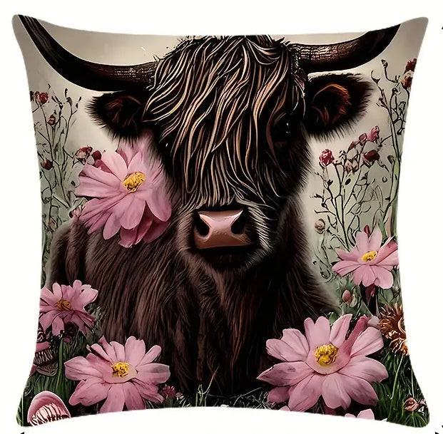 Square pillow cover featuring a Highland cow portrait surrounded by pink cosmos flowers and greenery.