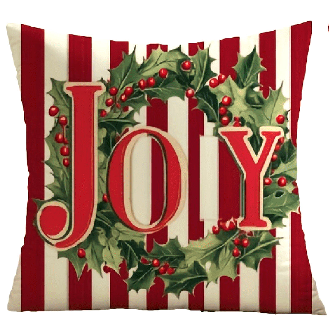 Red and white striped pillow cover with the word Joy and greenery accents