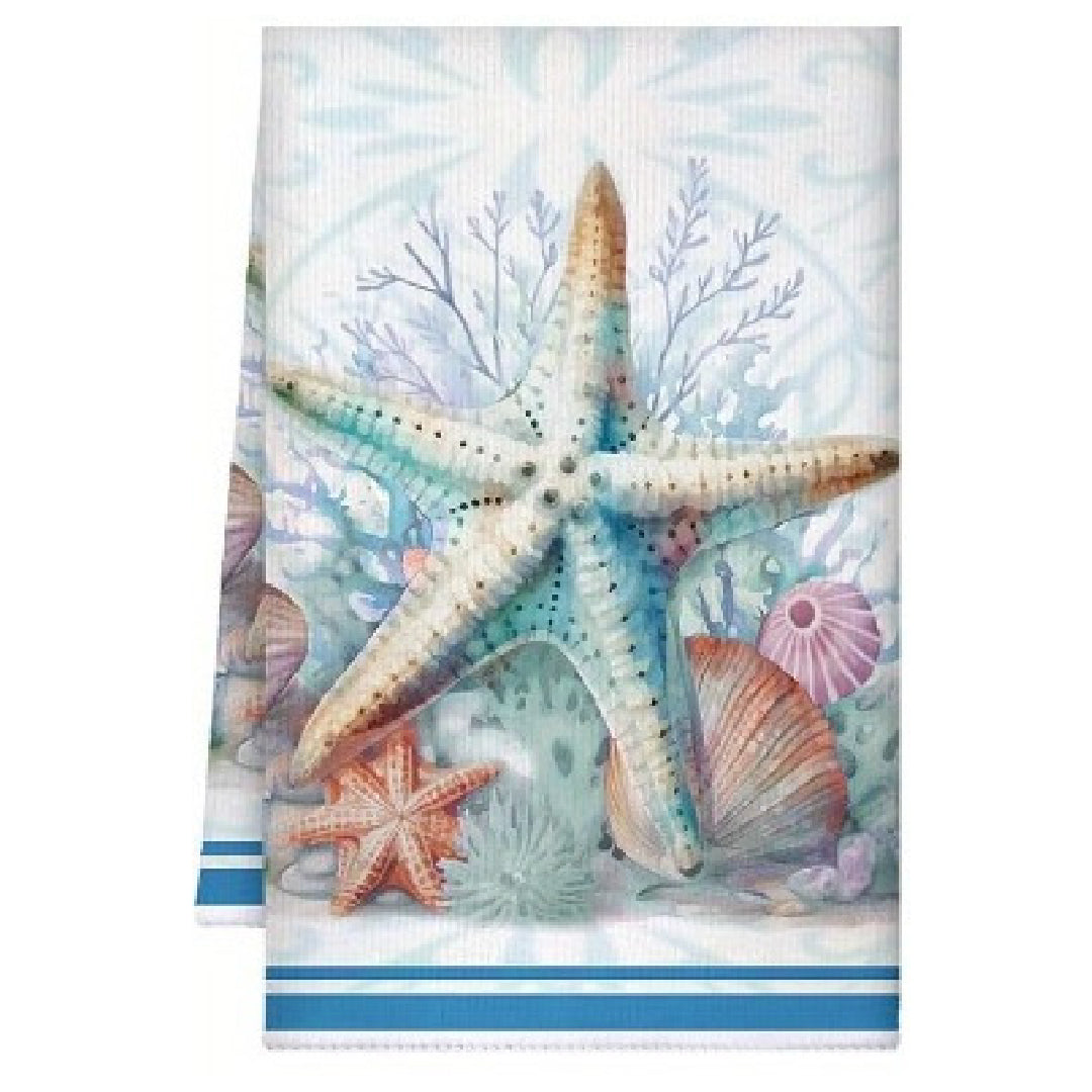 Towel with starfish and shell design on a white background