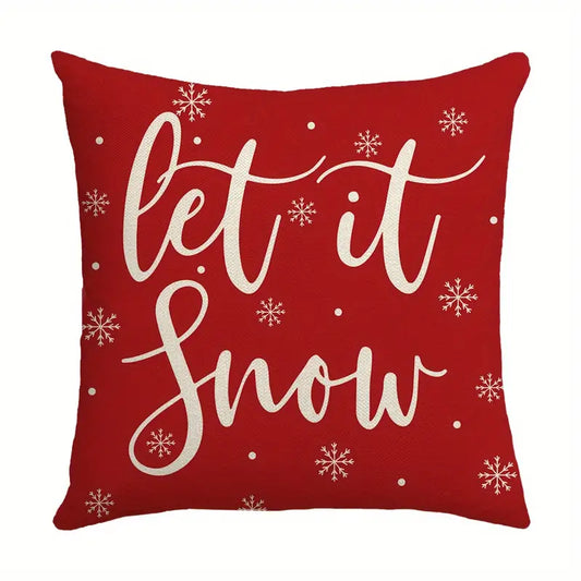 Red Let It Snow Christmas pillow cover with white script lettering and snowflakes