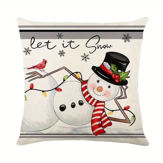 Linen pillow cover featuring a whimsical snowman with a red cardinal, festive lights, and "Let it Snow" typography for winter home décor - 18x18.