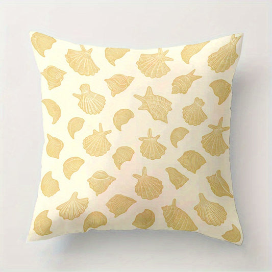 Pillow with gold shell pattern on a white background