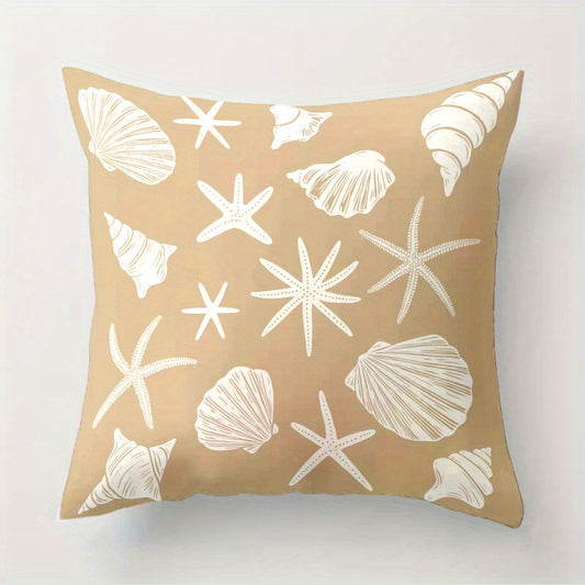 Beige pillow with white shell and starfish pattern on a light gray background
