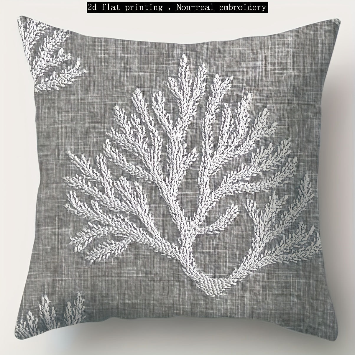 Gray coastal pillow cover with white coral illustration printed on woven fabric.