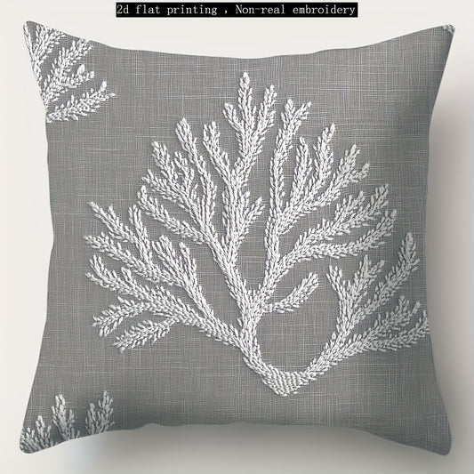 Gray coastal pillow cover with white coral illustration printed on woven fabric.