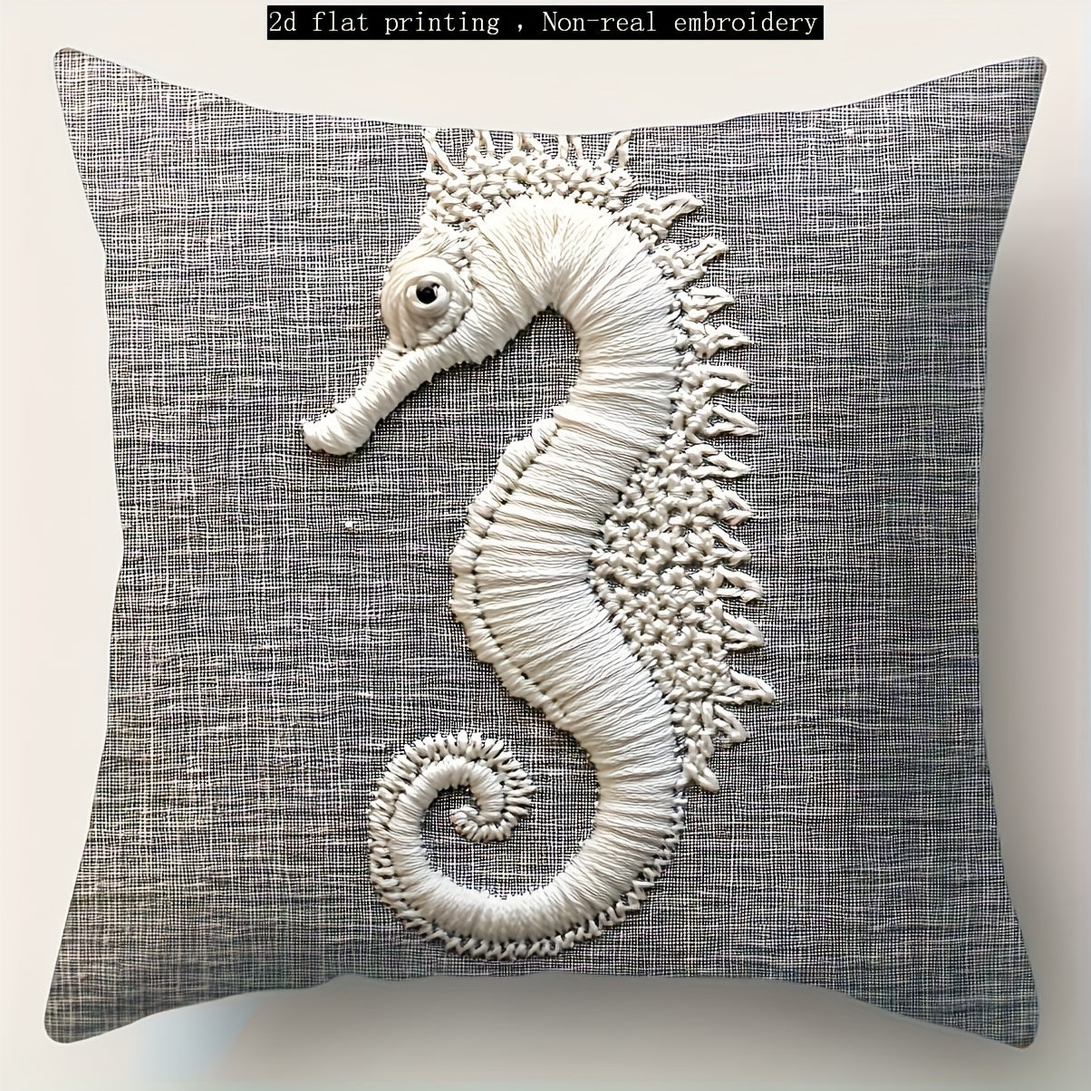 Gray coastal pillow cover with white seahorse illustration printed on woven fabric.