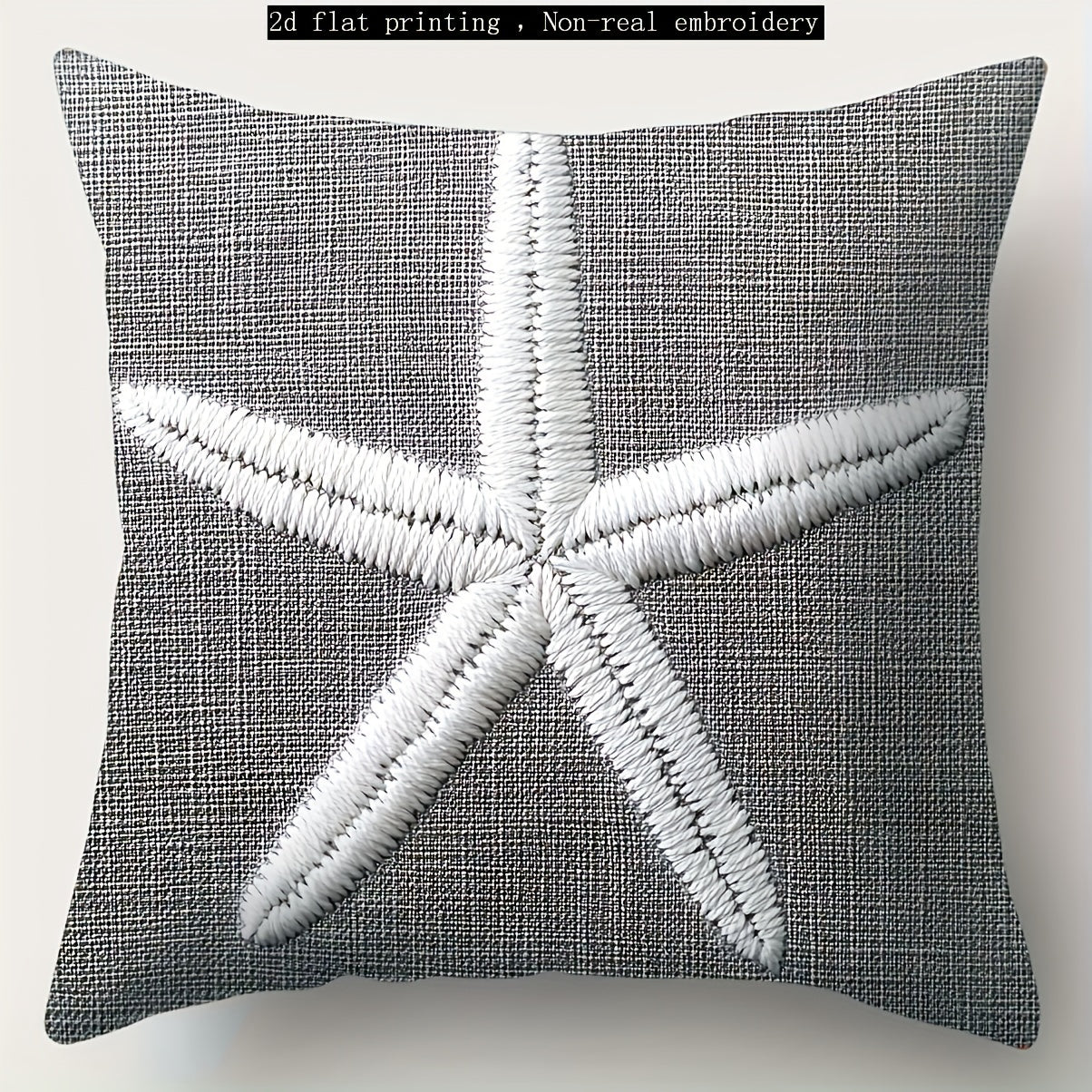 Gray coastal pillow cover with white starfish illustration printed on woven fabric.