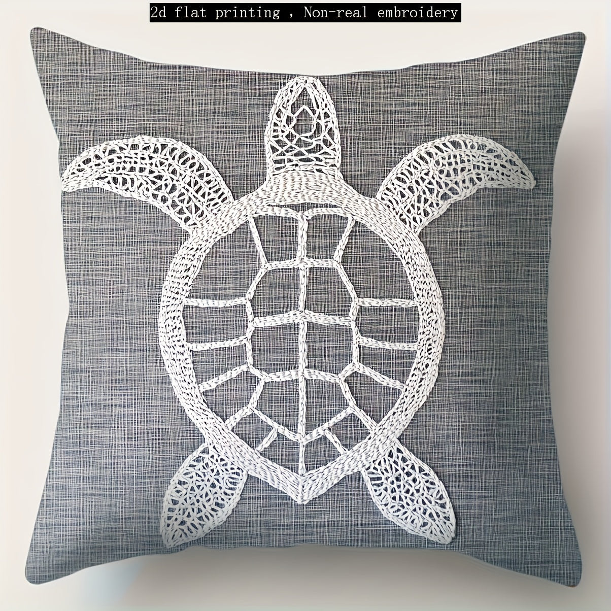 Gray coastal pillow cover with white sea turtle illustration printed on woven fabric.