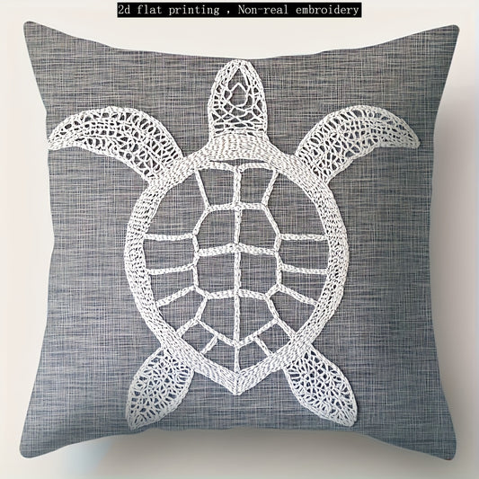 Gray coastal pillow cover with white sea turtle illustration printed on woven fabric.