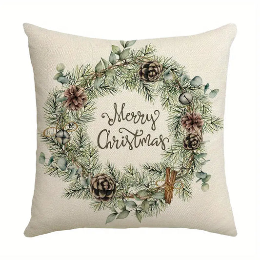 Merry Christmas pillow cover with greenery wreath, pinecones, and winter botanical elements on a neutral background