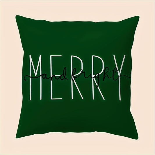 Green pillow cover with the word merry in large white lettering