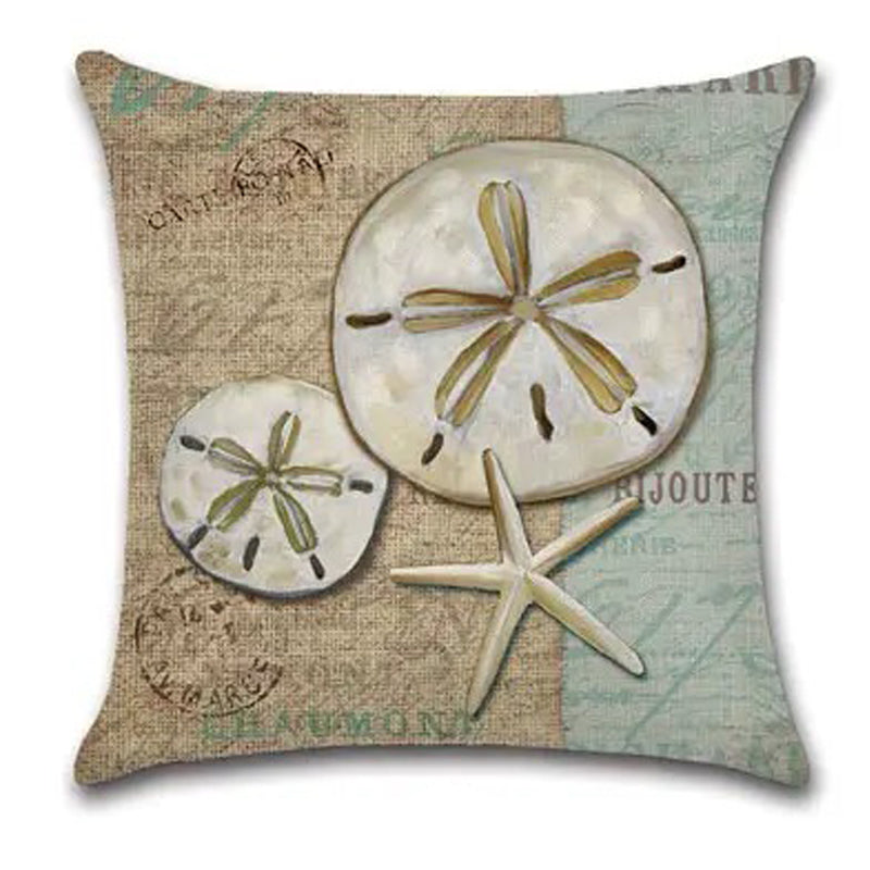 Pillow cover featuring sand dollars and a starfish on a burlap-style vintage postcard background.