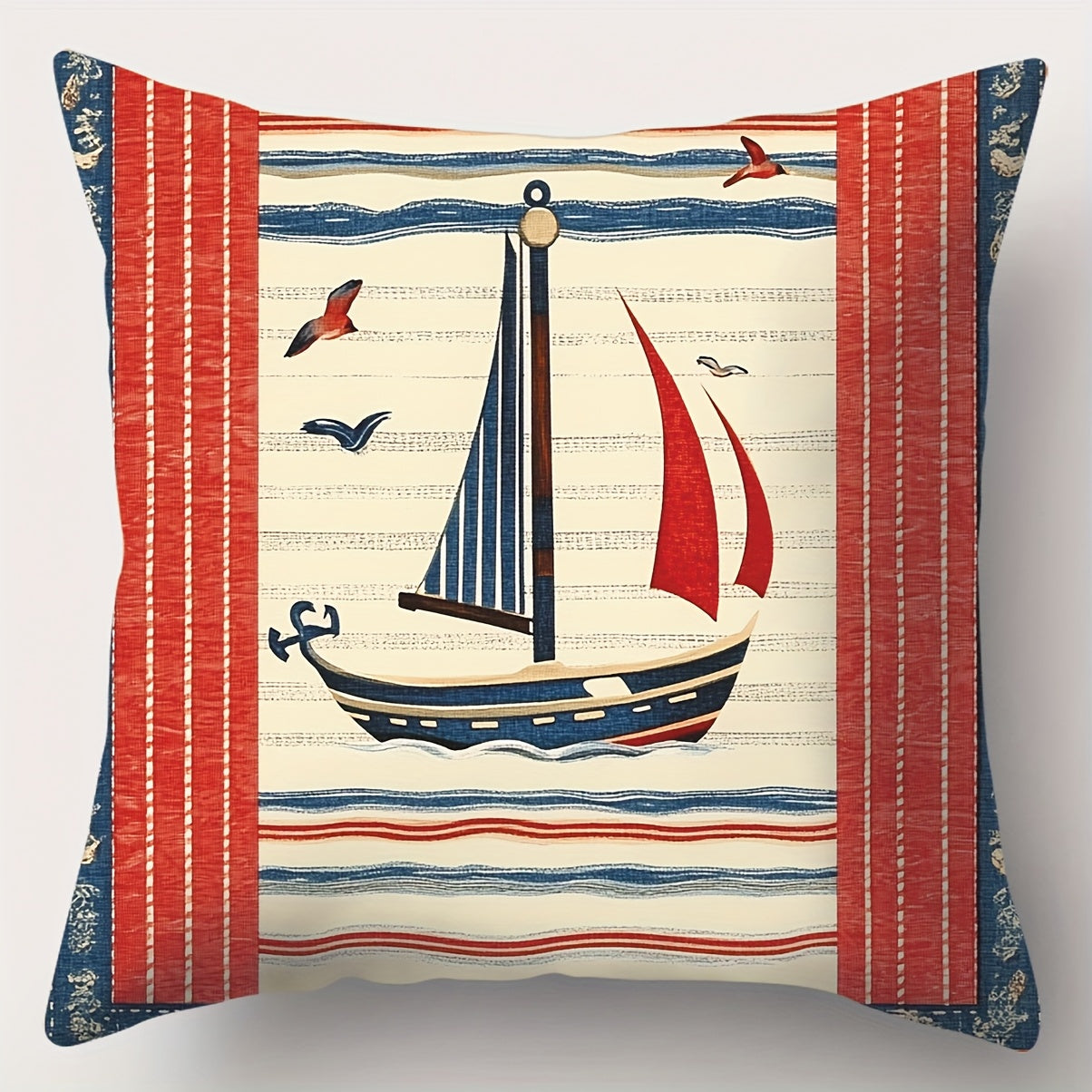 Square nautical pillow cover featuring a red, navy, and ivory sailboat design with horizontal nautical stripes, rope and anchor accents, and hidden zipper closure.