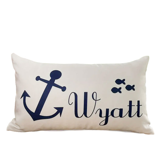 12"x20" navy anchor linen lumbar pillow cover featuring the printed name “Wyatt” and fish silhouettes.