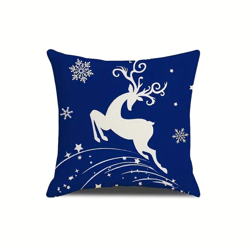 Navy blue outdoor pillow cover featuring white reindeer silhouette with snowflakes on dark blue background.