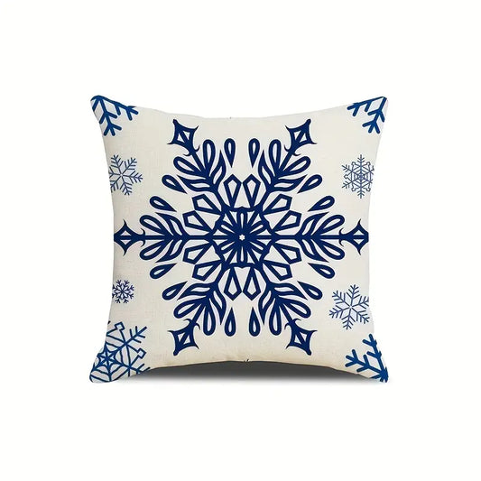 Navy blue outdoor pillow cover featuring large blue snowflake design on light background.