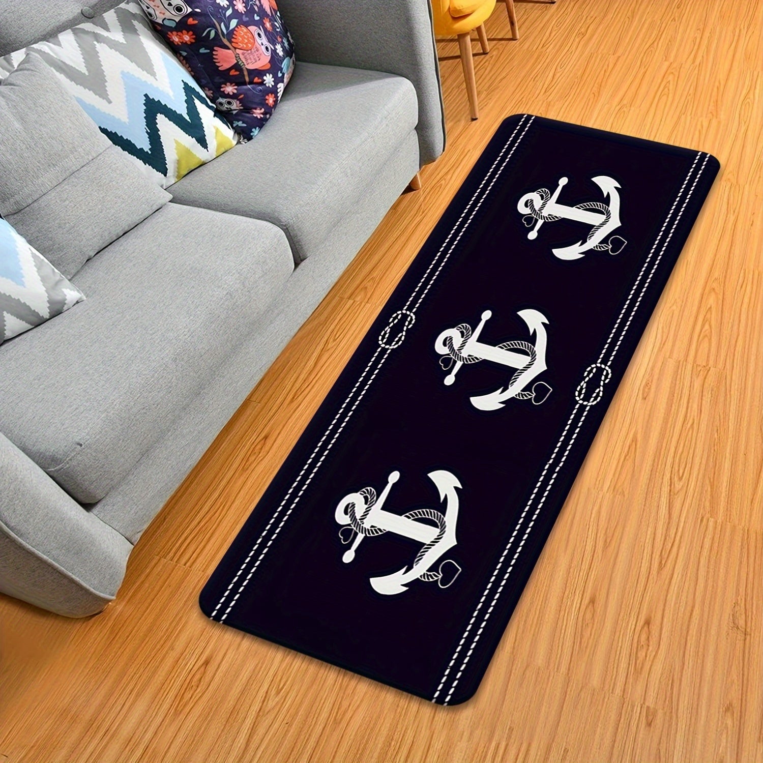 Navy runner mat featuring repeating white nautical anchors on a deep blue background.