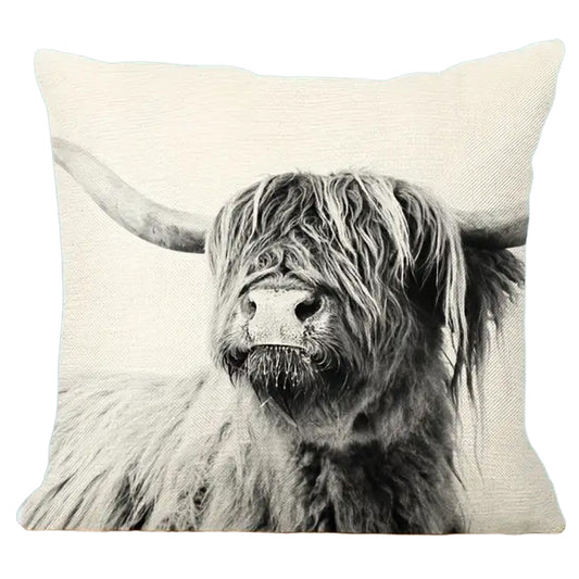 Square linen pillow cover featuring a monochrome Highland cow portrait on a neutral textured background.
