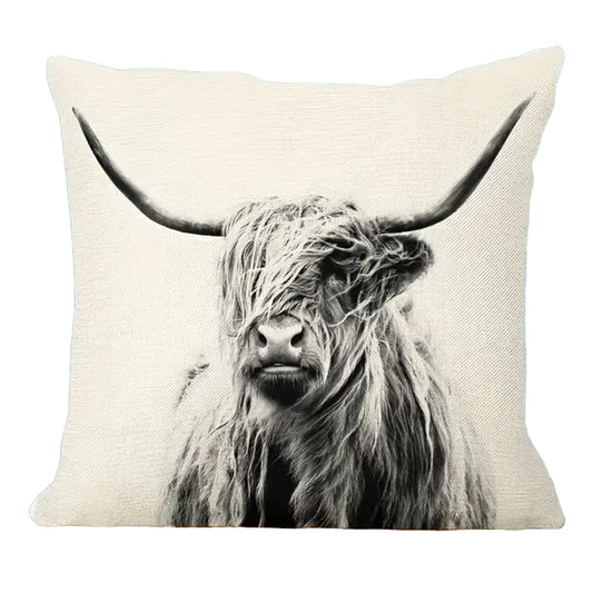 Square linen pillow cover featuring a monochrome Highland cow profile with extended horns on a neutral background.