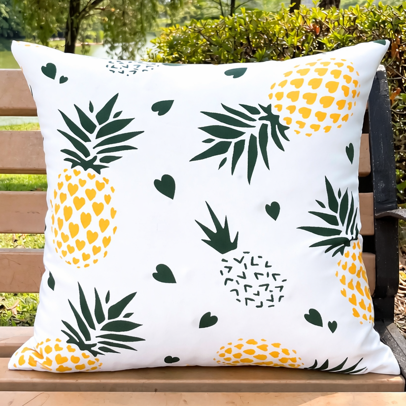 Decorative 18x18 waterproof outdoor pillow cover featuring a repeating pineapple and leaf pattern in yellow and green on a white background.